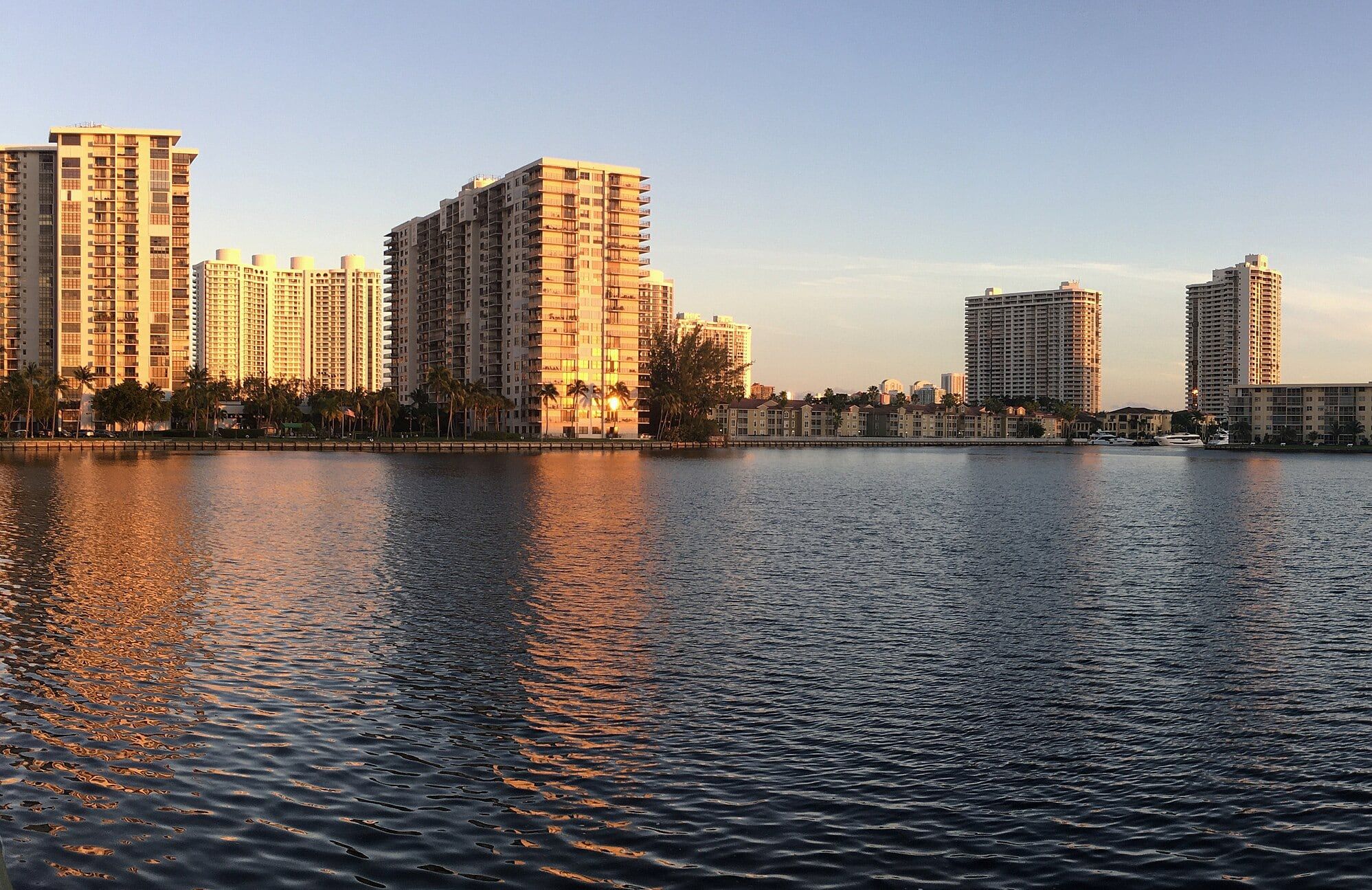 Aventura condo towers across the Intracoastal at golden hour