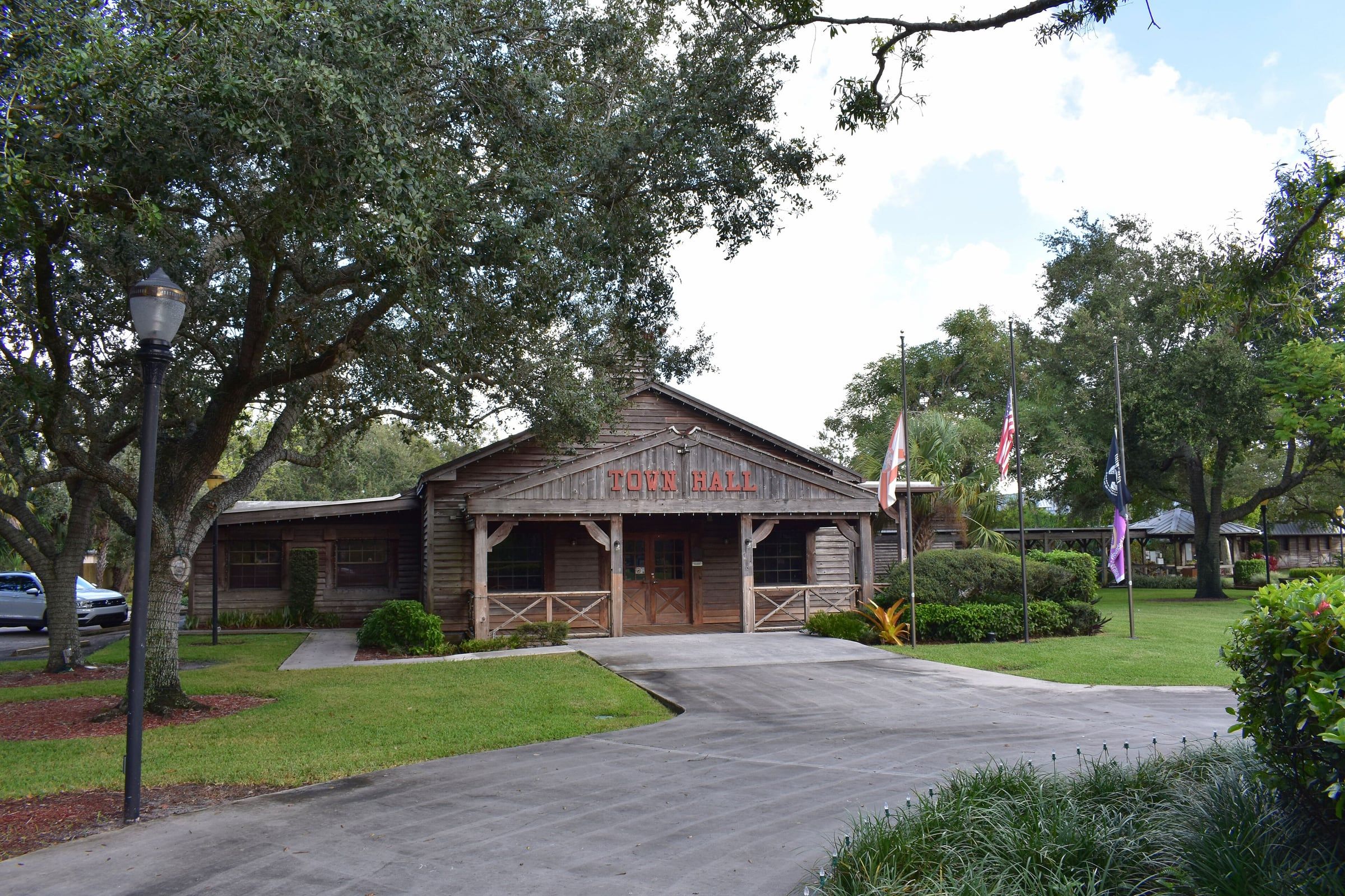 Old West-style Davie Town Hall under oak trees