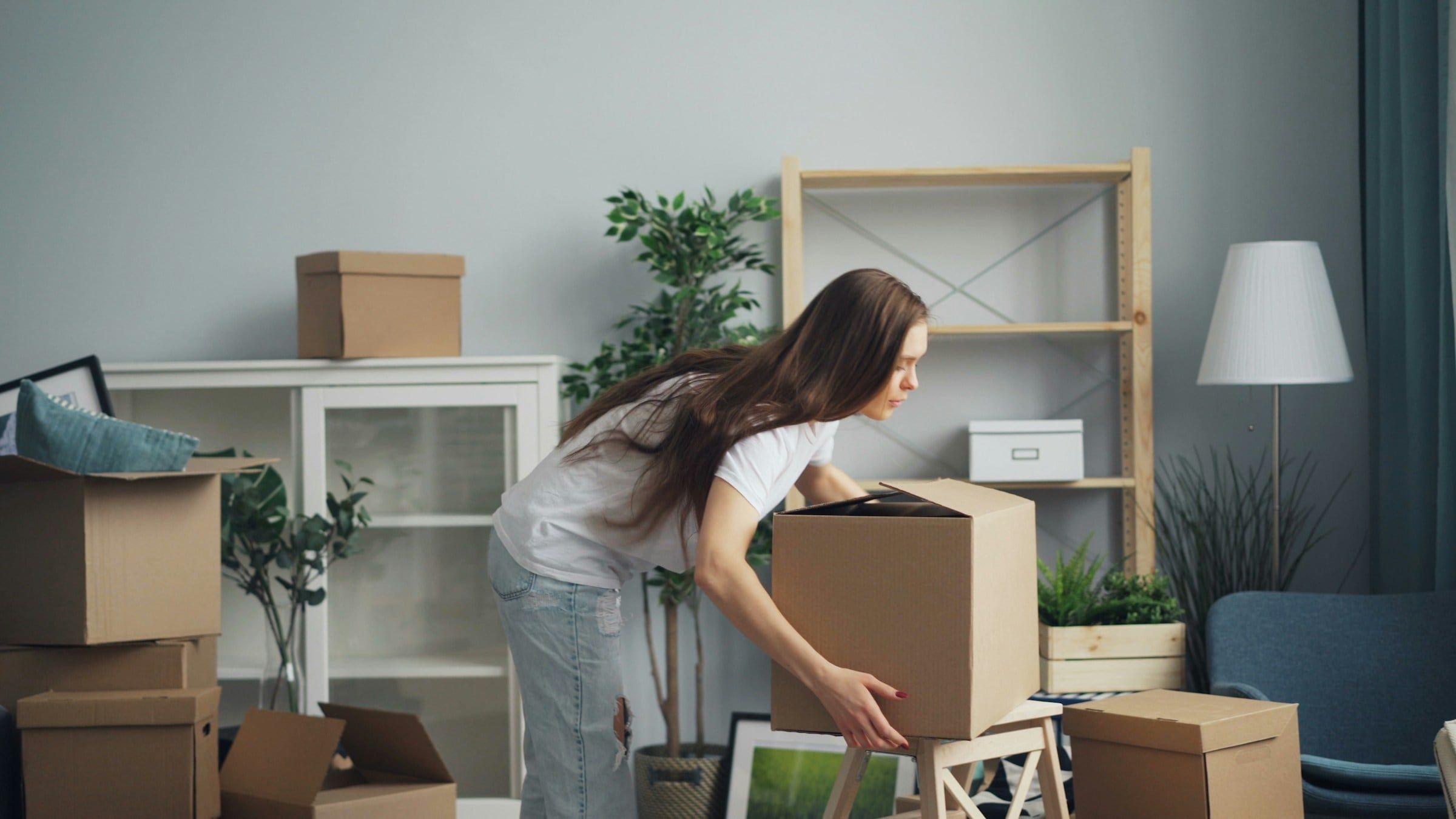 Packing boxes in a bright living room
